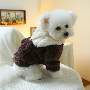 Detail of warm teddy fleece dog hoodie with cute ears and soft brown-white patchwork