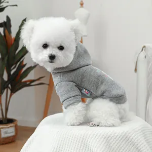 Close-up of light gray pet hoodie featuring ribbed cuffs and a premium woven label detail