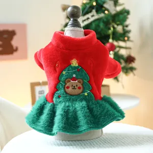 Close-up of festive Christmas pet dress with bear embroidery and soft velvet fabric
