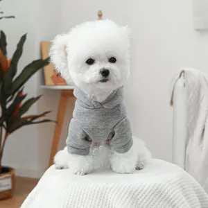Gray pet hoodie with raglan sleeves on a small white dog for comfortable daily wear