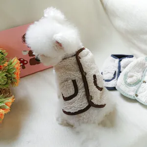 Detail of plush fleece pet vest featuring contrast trim and metal button closure