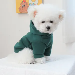 Deep green hooded pet sweatshirt for small dogs featuring warm fleece and snug cuffs