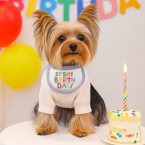 Dog birthday set with white ribbed t-shirt and striped birthday bib for pet party decor