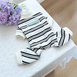 Detail of soft knit striped pet onesie with RAMA'STORY label and ribbed trims