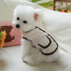 Detail of warm off-white fleece pet vest with brown trim and small side pocket