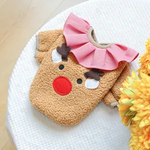 Close-up of brown fleece pet Christmas reindeer vest with red and white plaid ruffle collar