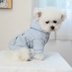 Light blue waffle-knit hooded pet sweater with paw embroidery on a small white dog