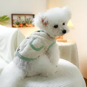 Close-up of warm pet fleece vest with light green trim and functional pocket detail