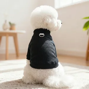 Detail of black ribbed knit pet shirt with integrated back D-ring for dog leash attachment