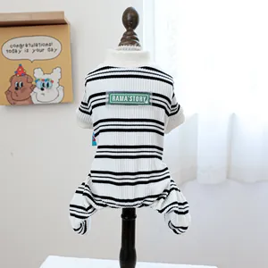 Striped black and white pet jumpsuit on wooden display stand for small dogs and cats
