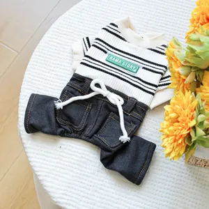 Detail of pet jumpsuit with striped top, denim bottoms and RAMA'STORY brand label