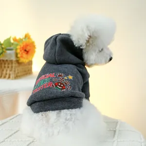 Detail of dark grey pet hoodie with official cookie tester print on a white dog