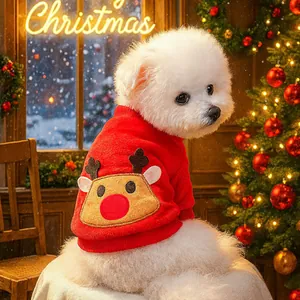 Detail of red pet Christmas sweater with reindeer embroidery on cozy warm fleece fabric