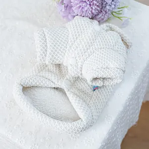 Detail of warm waffle knit pet hoodie with thick plush lining and white buttons
