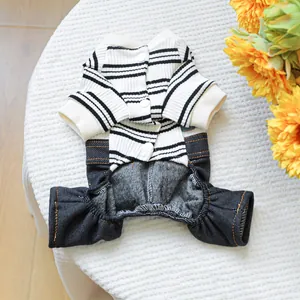 Detail of pet jumpsuit featuring black and white stripes and denim patchwork with buttons