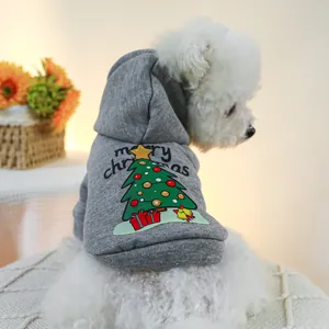 Close-up of grey pet hoodie with Merry Christmas tree print and bell detail on a dog