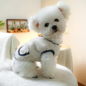 Detail of warm sherpa fleece pet vest with blue contrast trim and back pocket