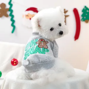 Close-up of grey dog knit sweater with OH SNAP gingerbread man embroidery and soft texture