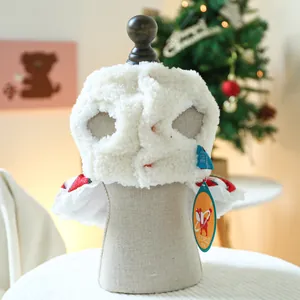 Detailed view of plush white fleece pet hoodie with festive Christmas bell and red accents