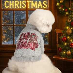 Detail of grey knitted pet sweater with Christmas gingerbread man and OH SNAP embroidery
