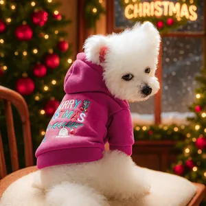 Detail of fuchsia pet hoodie with Merry Christmas embroidery and soft fleece texture