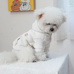 Close-up of pet hoodie with waffle texture fabric and sequined paw print embroidery