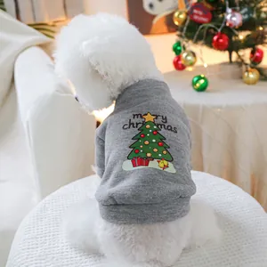 Detailed view of gray pet hoodie with Christmas tree print and merry christmas text on dog