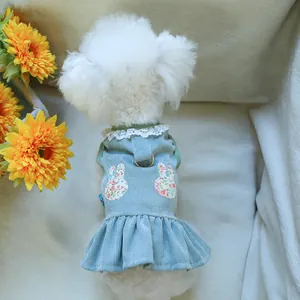 Detail of light blue corduroy pet dress with floral bunny patches and metal D-ring