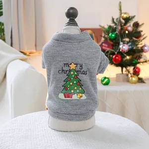 Close-up of grey pet hoodie with Merry Christmas tree print on soft knit fabric