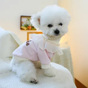 Close-up of pink pet sweatshirt with lace ruffle collar and Cake embroidery