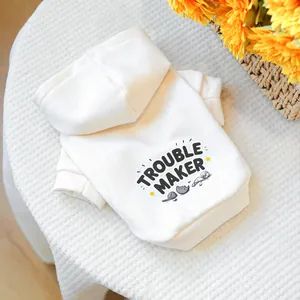 Detail of white pet hoodie with black Trouble Maker print and star graphics