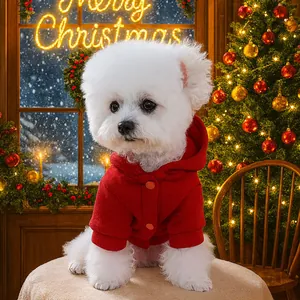 Festive red hooded pet sweater with button detail for small dogs in Christmas setting