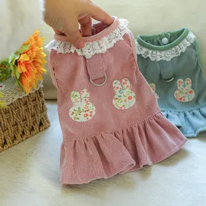 Detail of pet dress with lace collar, floral bunny patch, and metal D-ring for leash