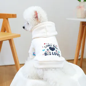 Detail of off-white pet hoodie featuring SMALL DOG BIG LOVE print on soft cotton fabric
