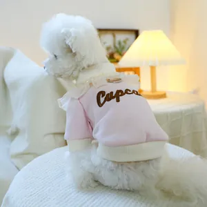 Close-up of pink pet cupcake sweatshirt with lace collar and brown embroidery detail