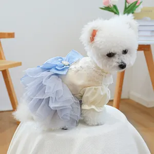 Elegant pet princess dress with yellow knit top, purple tulle skirt and blue bow for small dogs