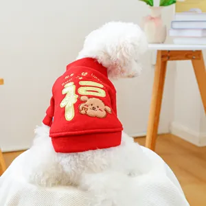 Detail of red festive pet sweatshirt with gold Fu character and Lucky embroidery