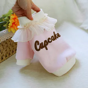 Detailed view of pink pet cupcake sweatshirt featuring white lace collar and embroidery