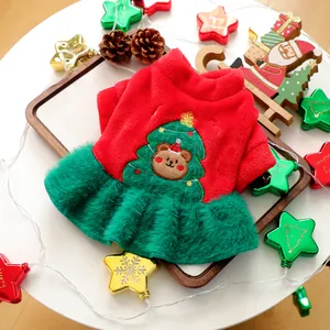 Detail of Christmas pet dress with reindeer bear embroidery and green faux fur trim