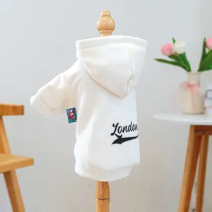 Detailed view of white pet hoodie featuring black London print on soft cotton fabric