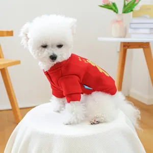 Detail of red festive pet sweater with gold Rich embroidery for dogs and cats