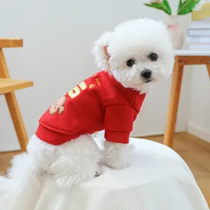 Close-up of red pet sweater featuring exquisite bear embroidery and lucky gold lettering