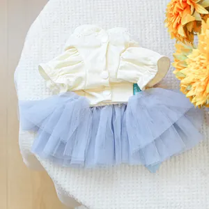 Detail of pet dress with yellow ribbed cotton top and purple layered mesh tutu skirt