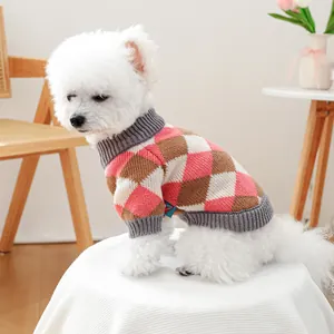 Classic argyle knit pet sweater in pink and brown shown on a small white dog