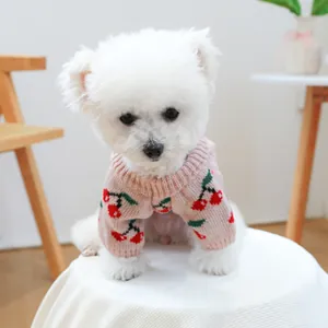 Pink knitted pet sweater with cherry patterns for small dogs and cats in autumn winter