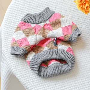 Detail of pet knit sweater showing argyle pattern and gray ribbed cuffs for small dogs