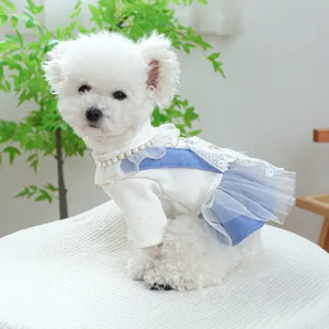 Detail of dog dress featuring high-neck white knit top and blue lace tiered skirt