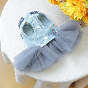 Detail of pet dress with floral embroidery, pearl buttons and mesh tutu skirt
