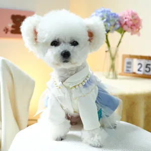 Close-up of pet dress with lace collar, faux pearls, and tiered blue mesh skirt