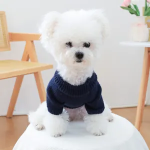 Close-up of a navy blue chunky knit pet sweater with high turtleneck design on a dog